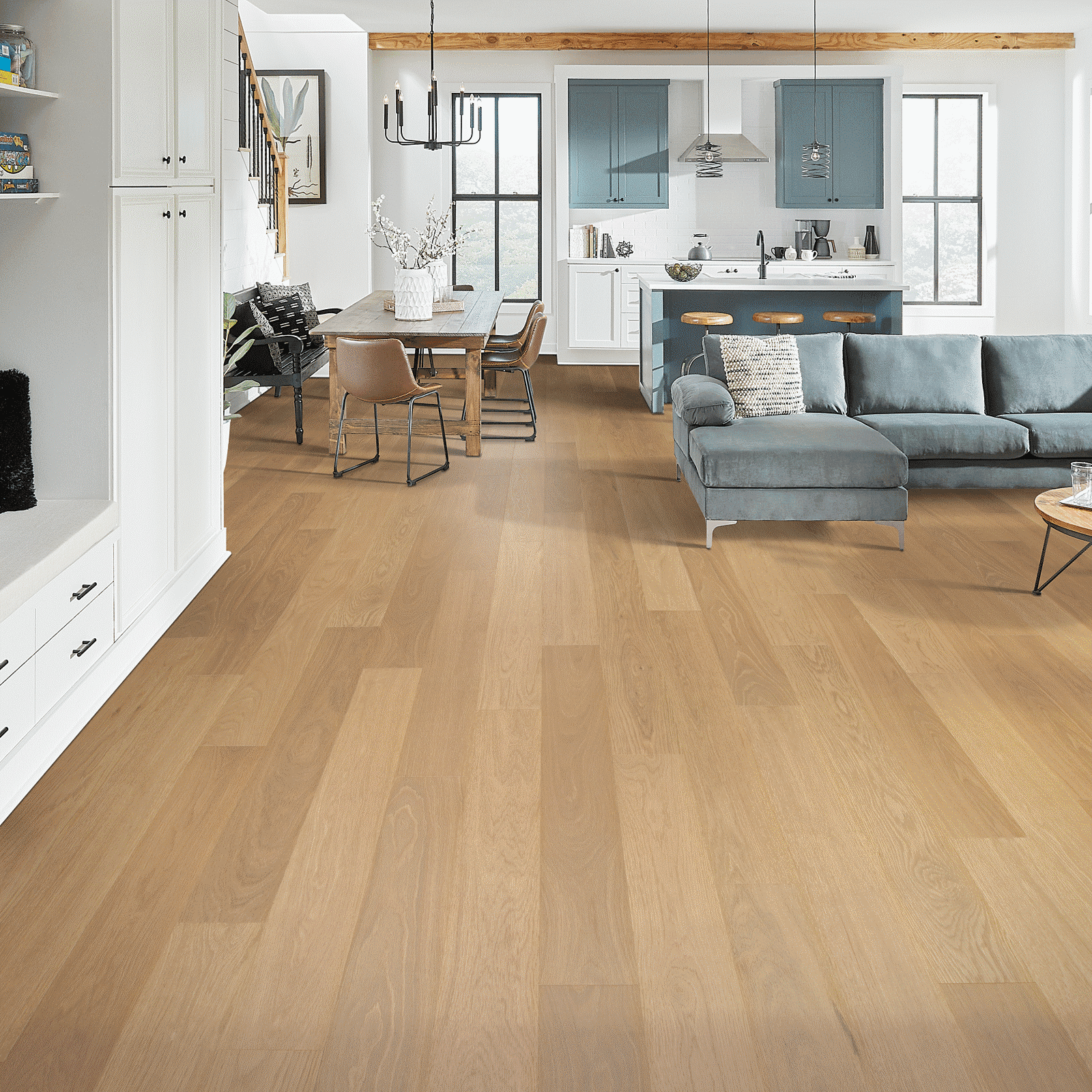 A living room with hard wood floors and furniture.