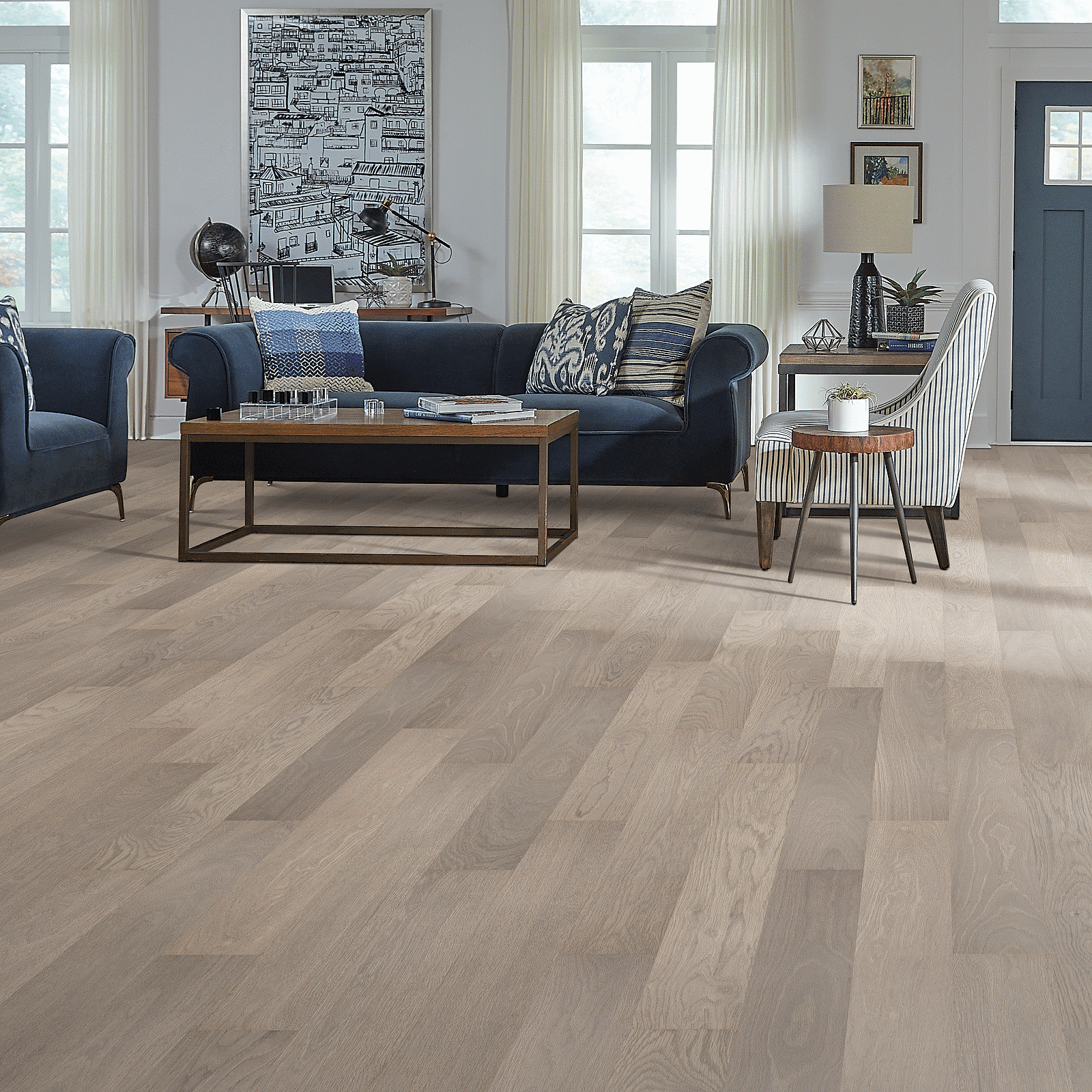 A living room with hard wood floors and furniture.