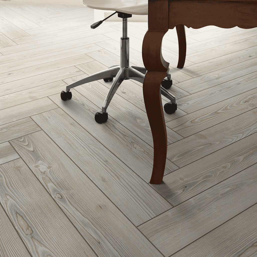 A wooden floor with a chair and table in the background.