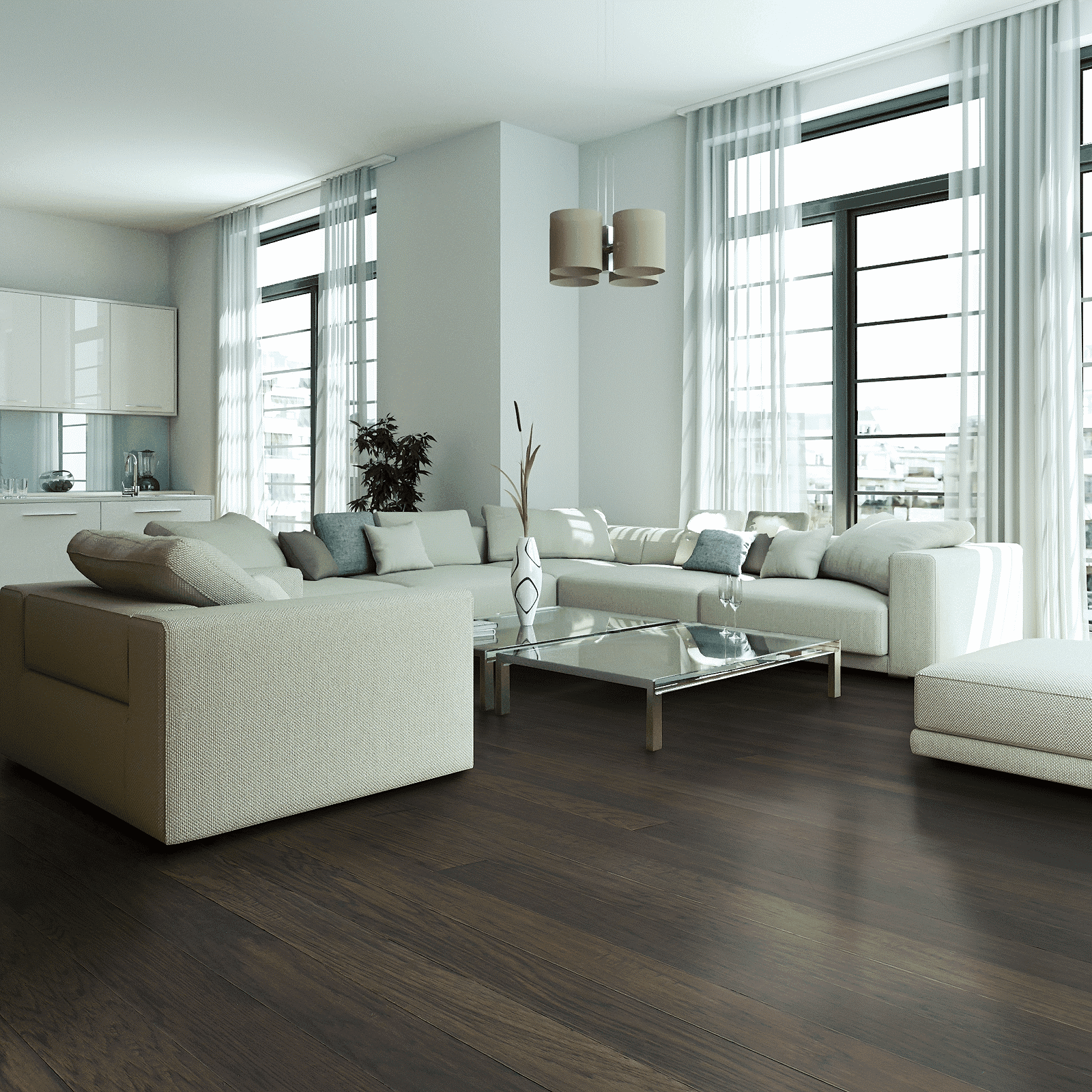 A living room with white furniture and large windows.