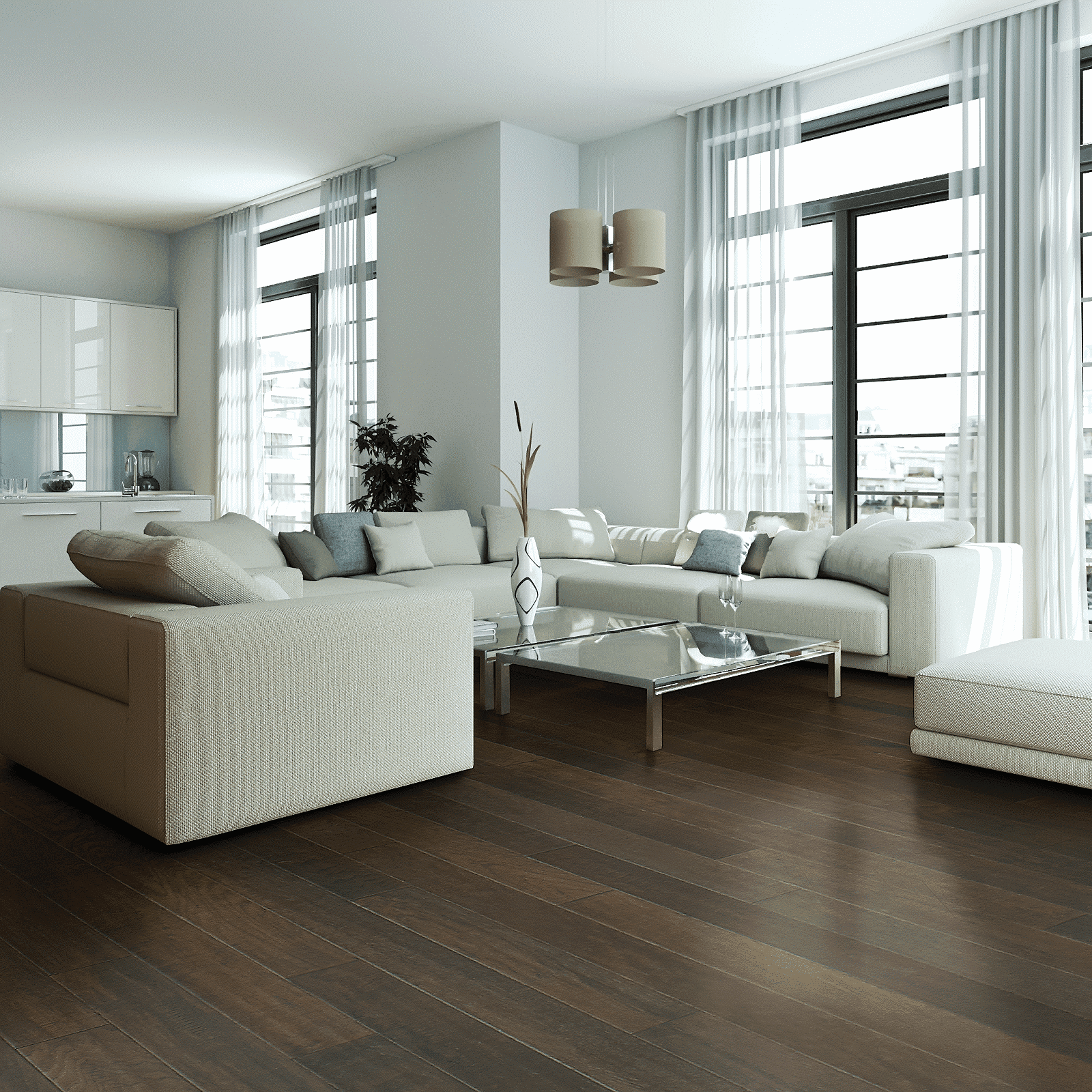 A living room with white furniture and large windows.
