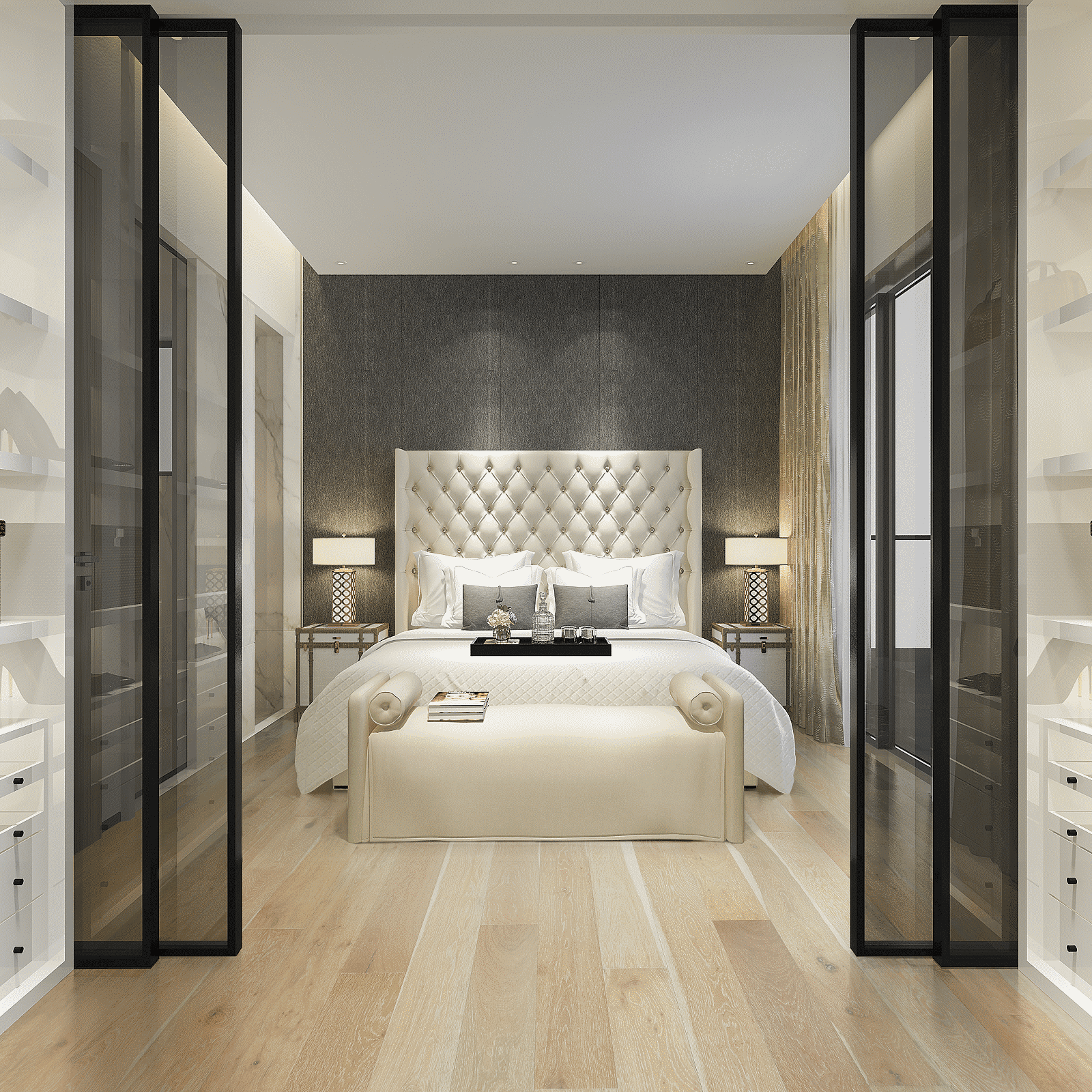 A bedroom with a bed and two lamps.