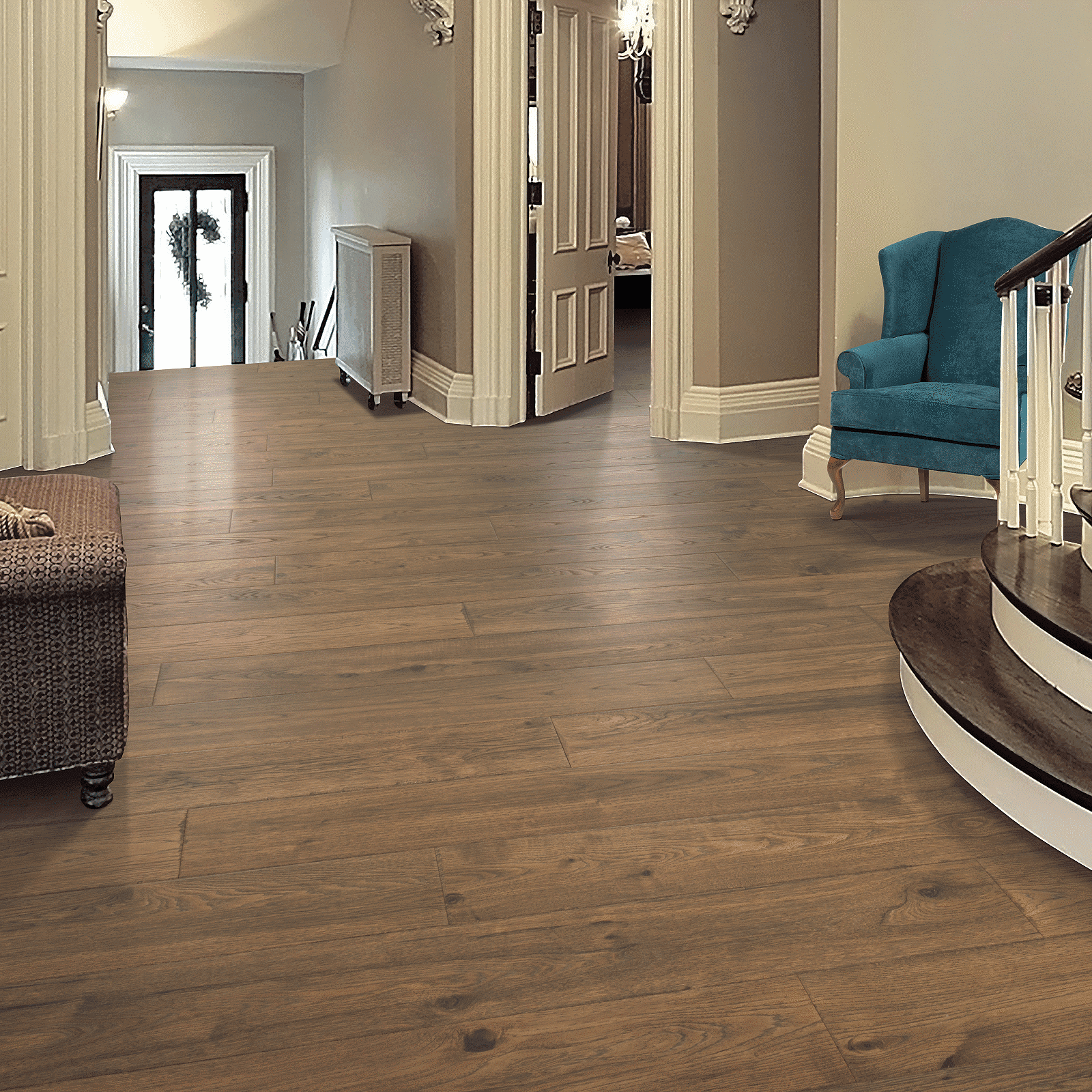 A large room with hard wood floors and a blue chair.