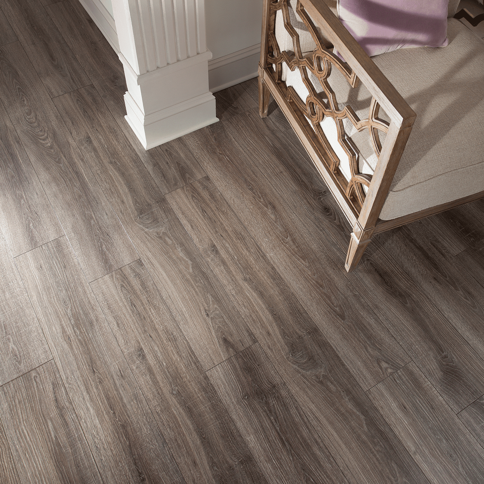 A room with wood floors and a chair.