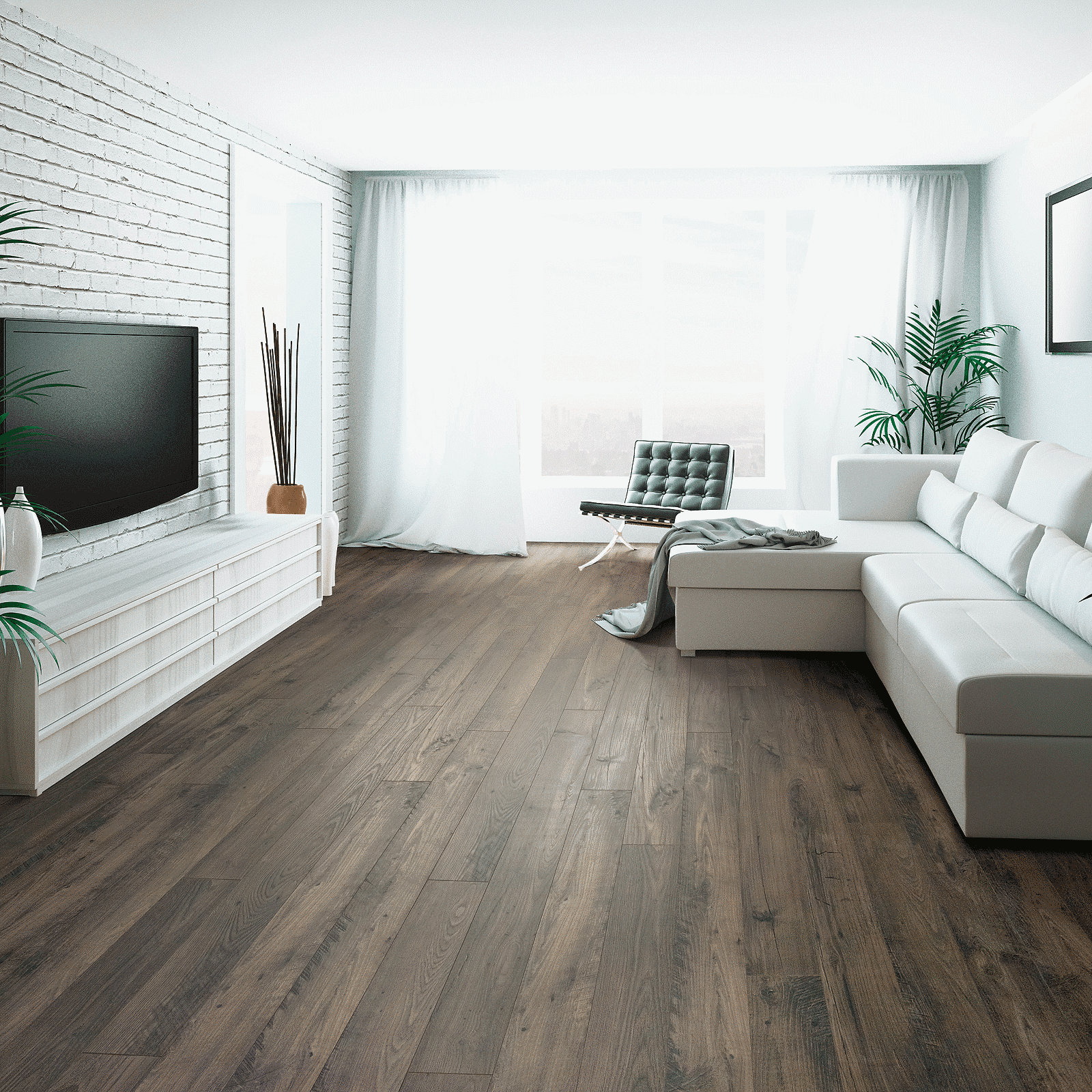 A living room with white furniture and a fireplace.