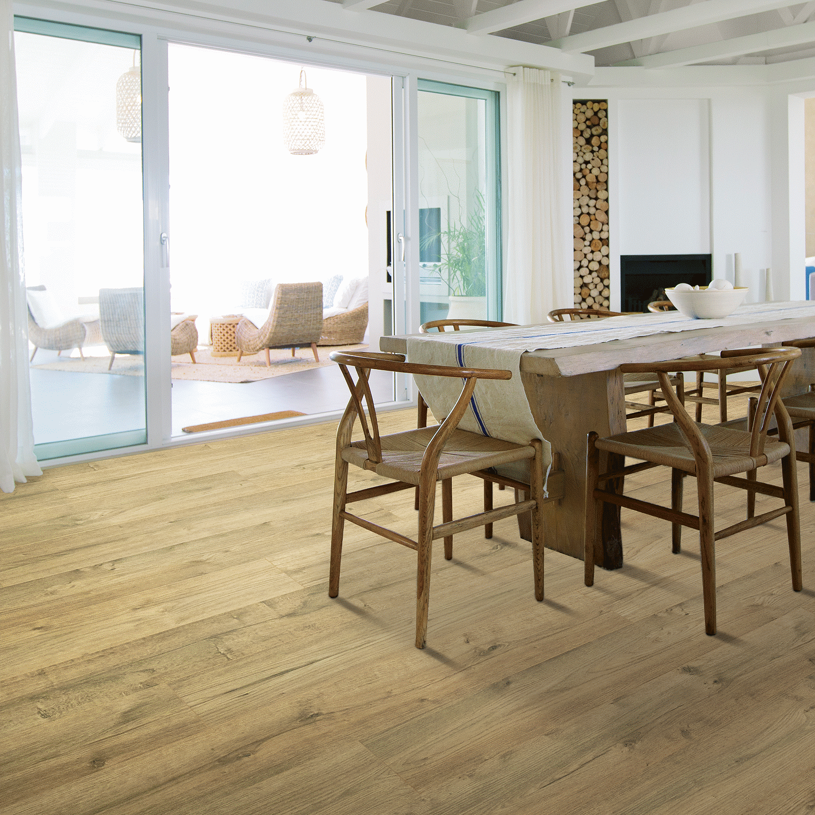 A dining room with wooden floors and chairs.