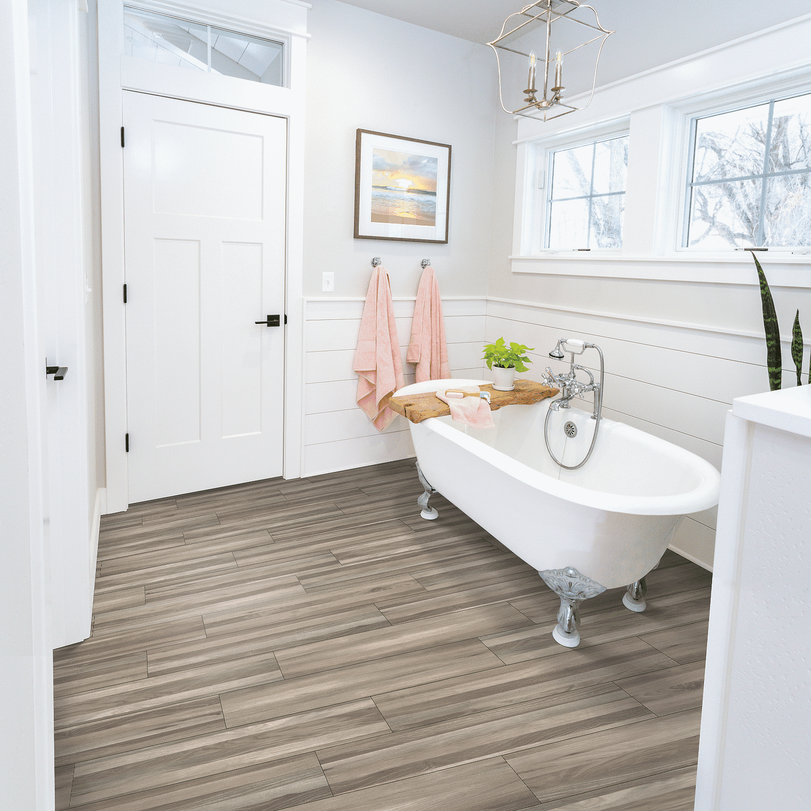 A bathroom with a tub and sink in it
