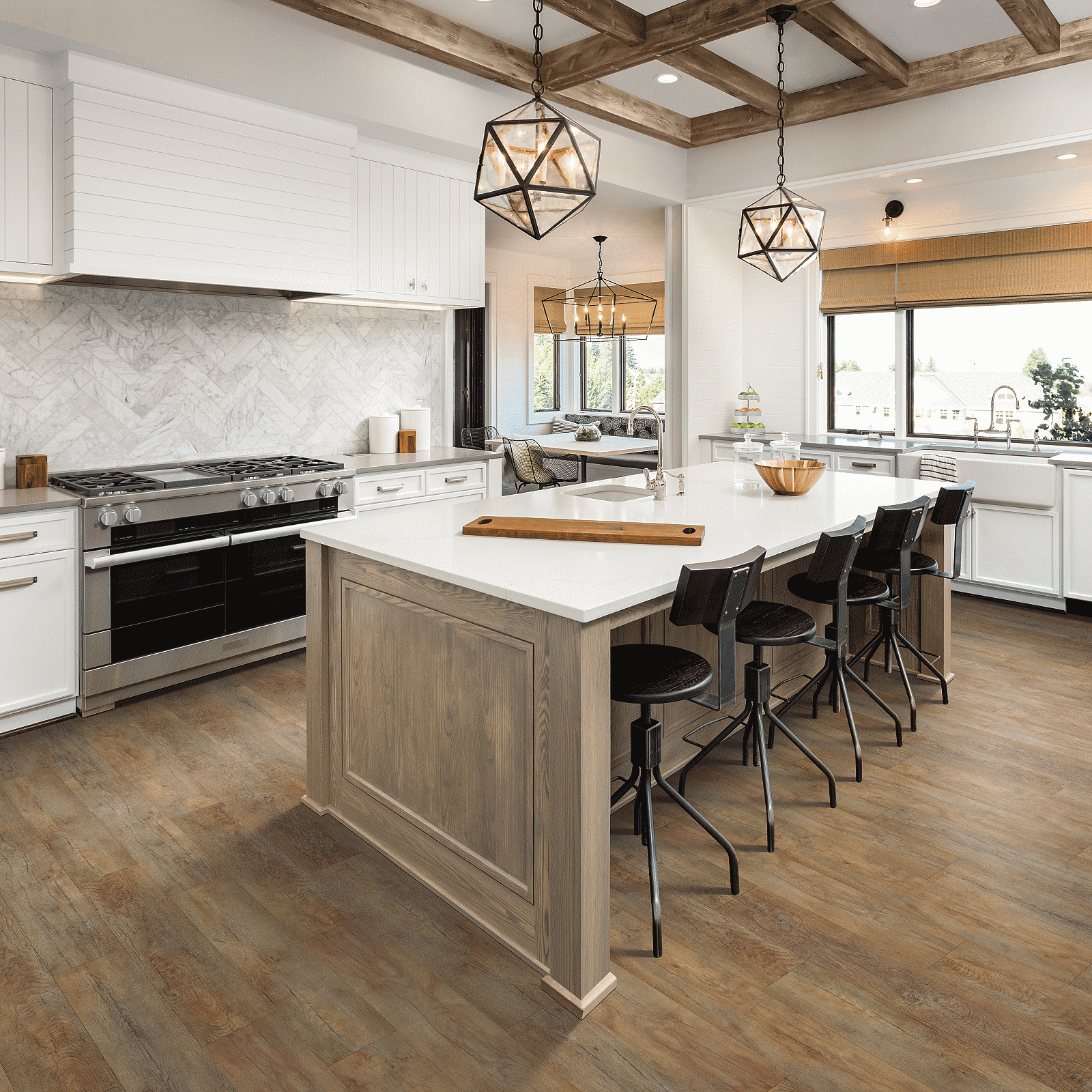 A kitchen with wooden floors and white walls.