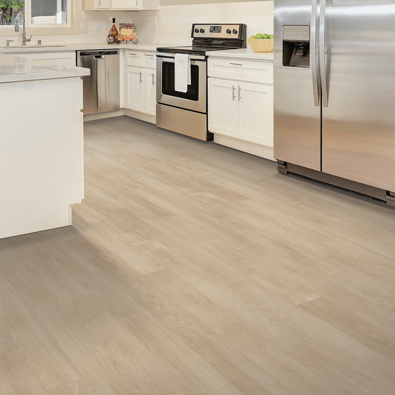 A kitchen with white cabinets and stainless steel appliances.