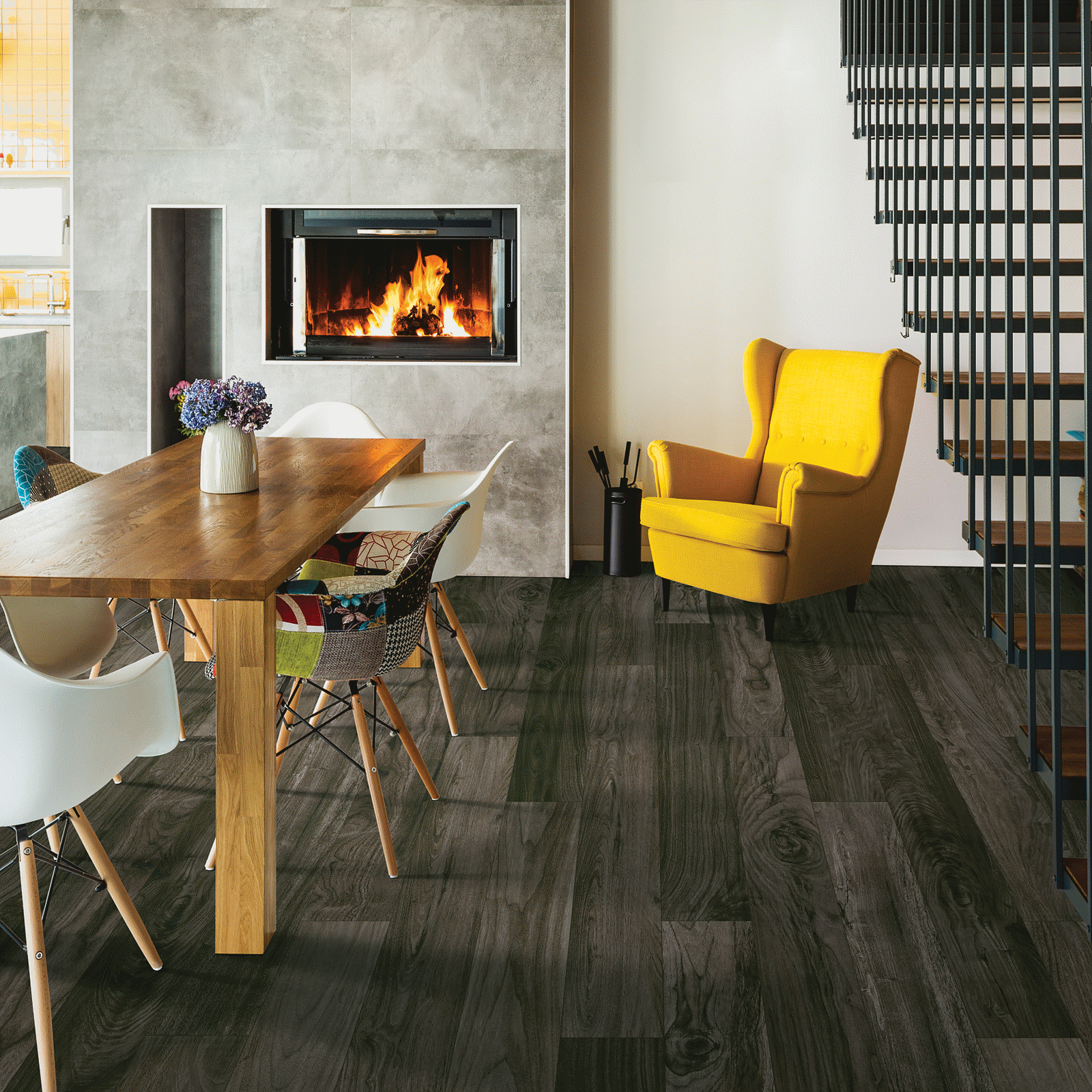 A room with a table and chairs, fireplace and fire place.