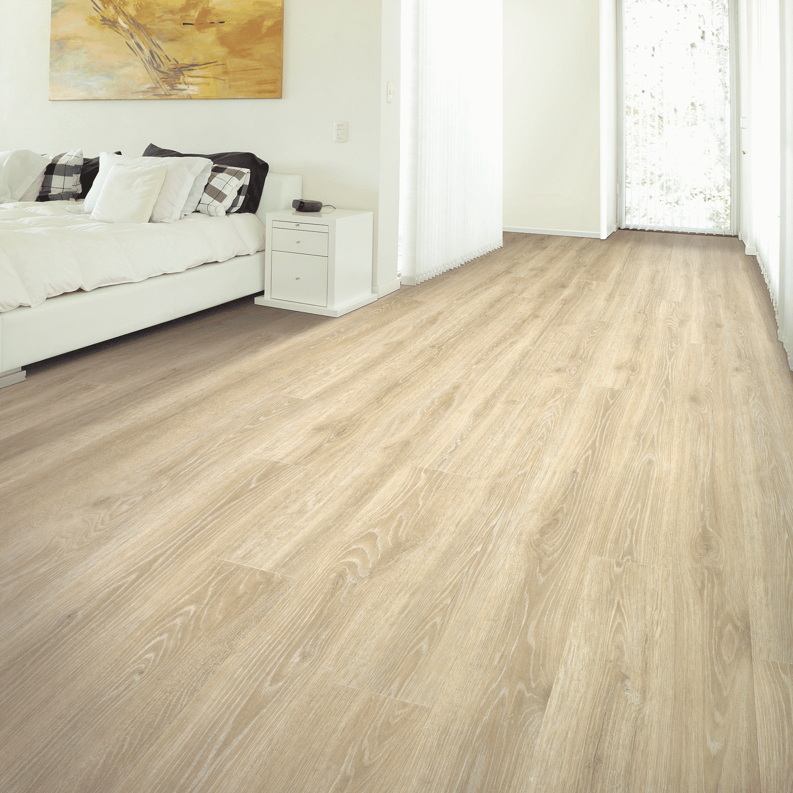 A room with white walls and wooden floors.