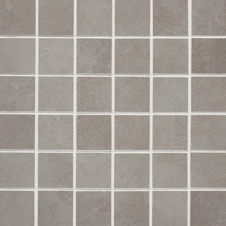 A close up of the tile surface of a bathroom floor