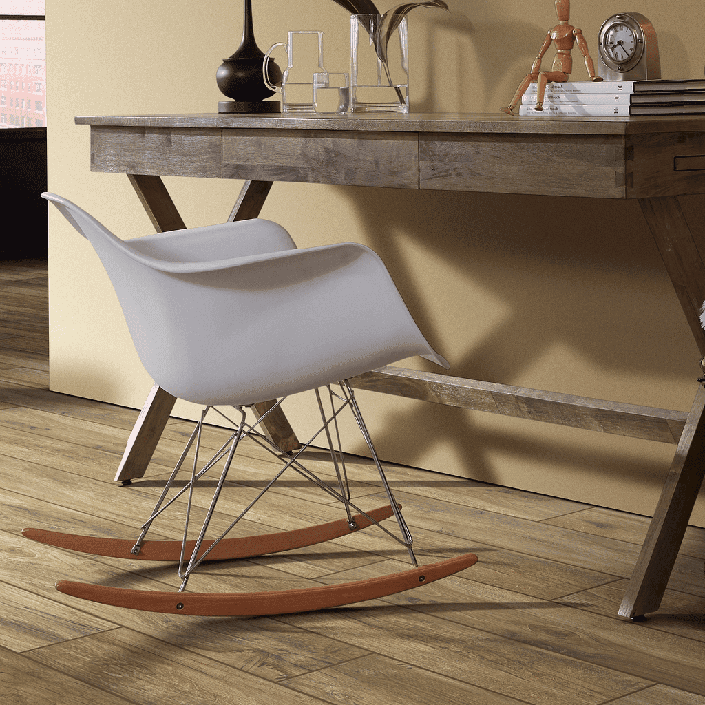 A wooden desk with two white chairs and a table