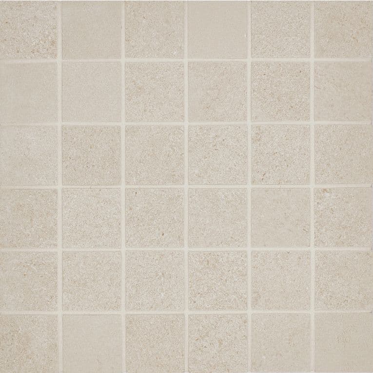 A white tile floor with some small squares