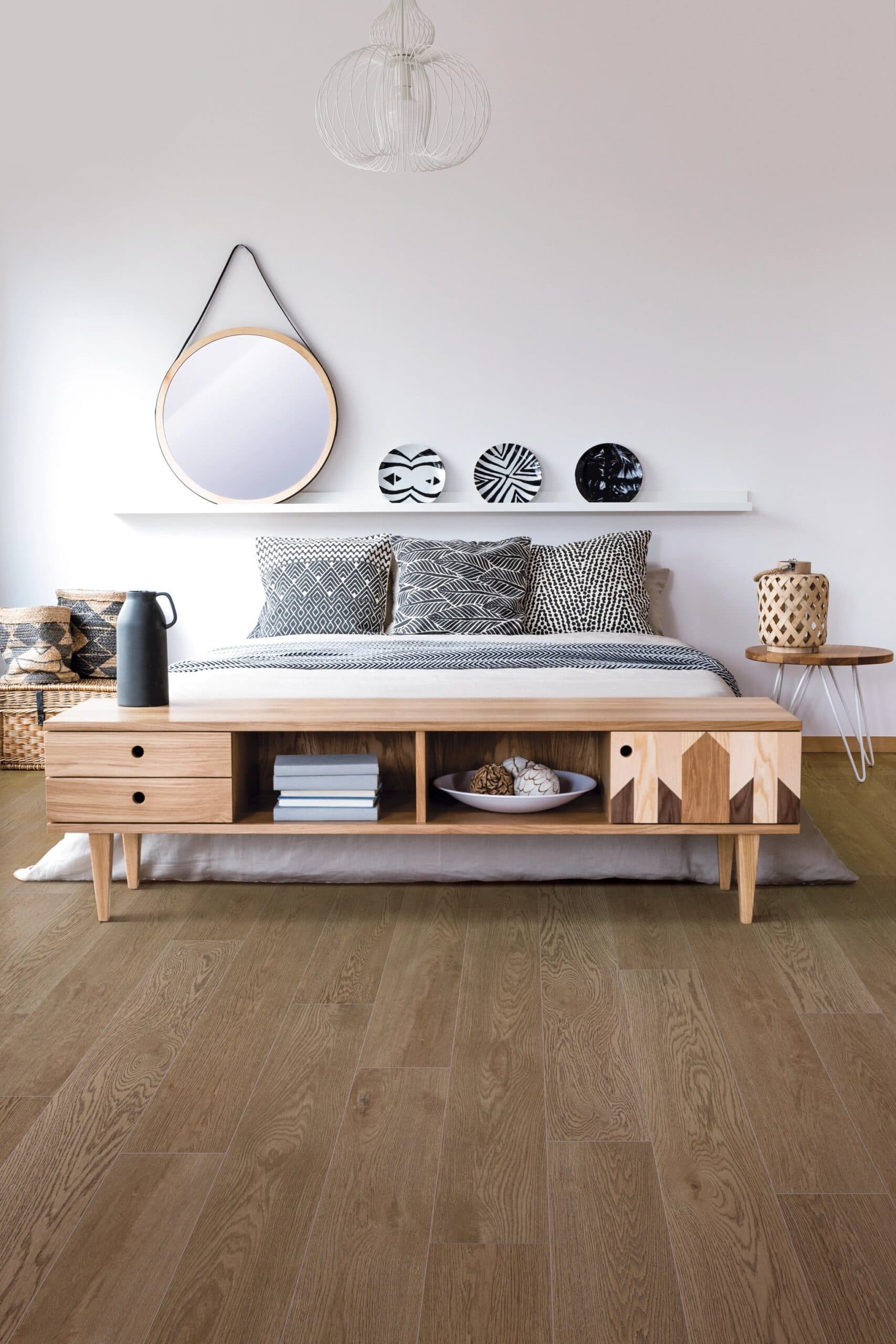 A bed room with a wooden bed and two tables