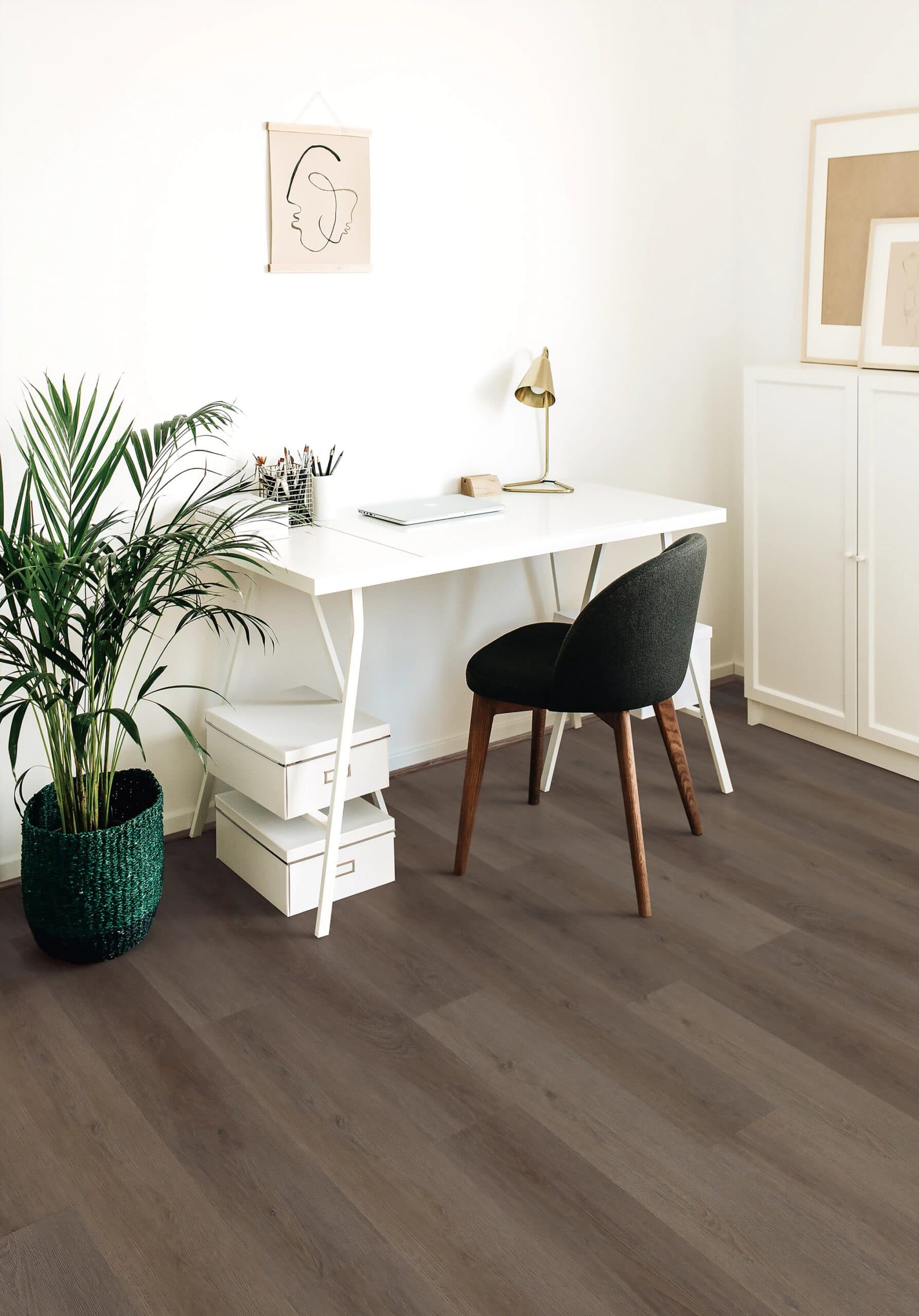 A chair and table in front of a desk.