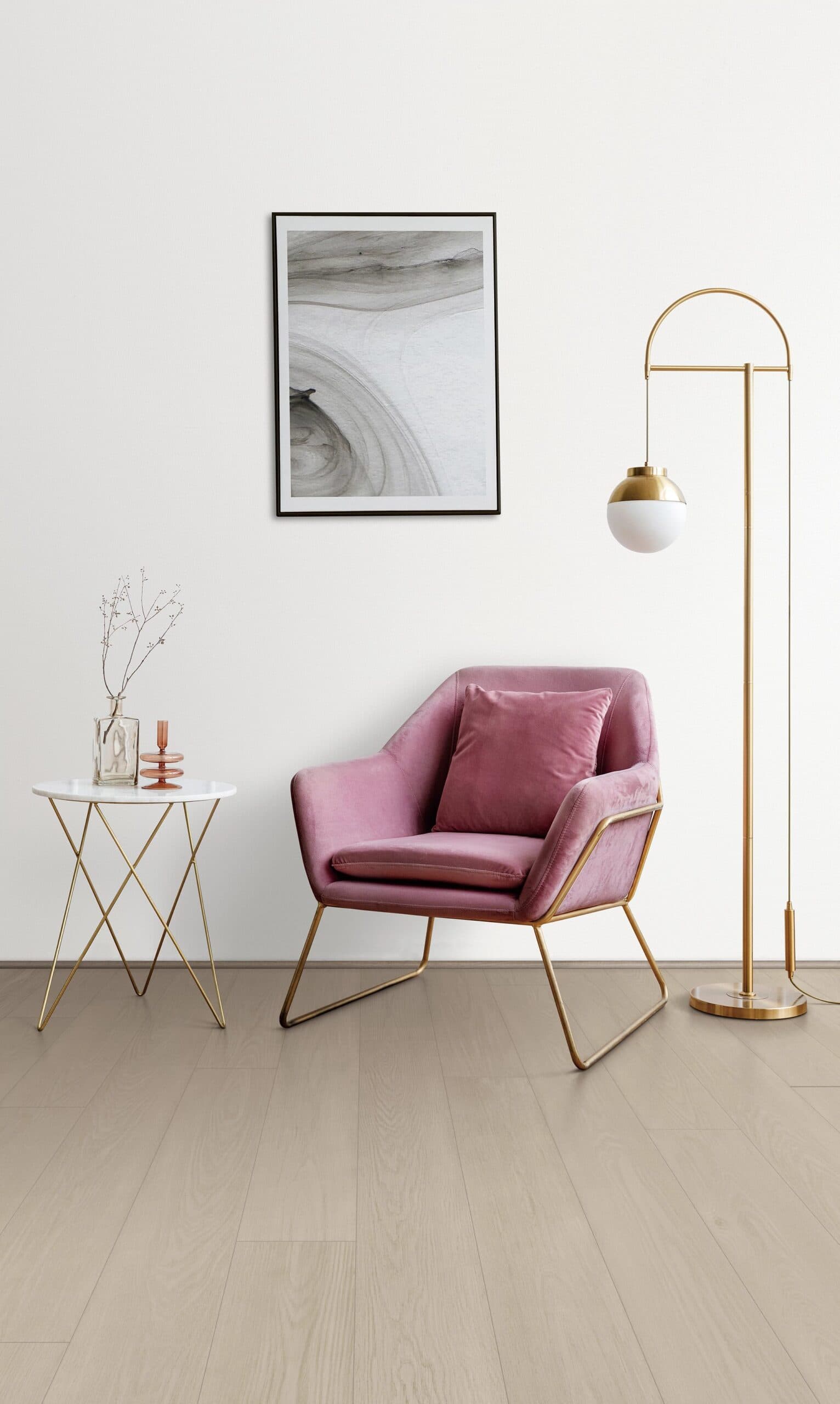 A pink chair and table in a room.