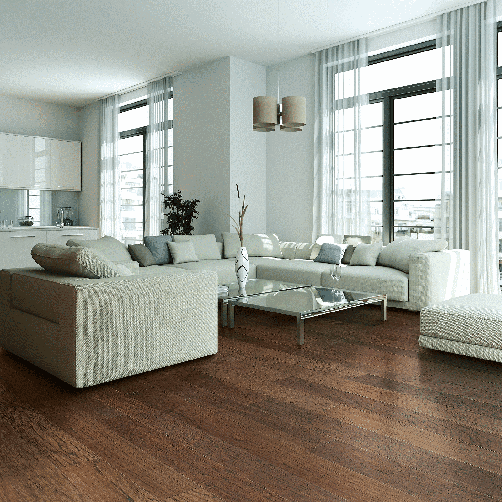 A living room with white furniture and large windows.