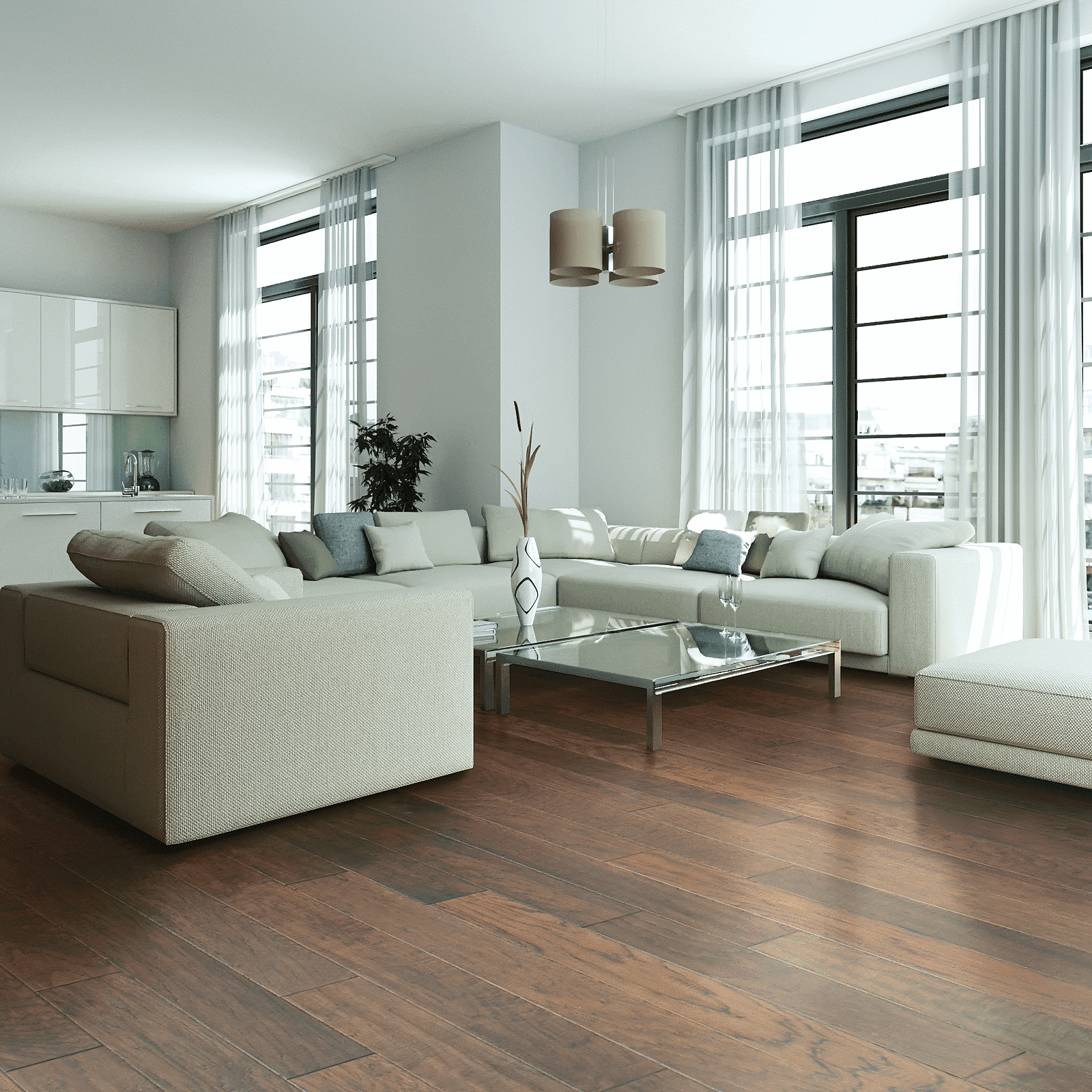 A living room with white furniture and large windows.