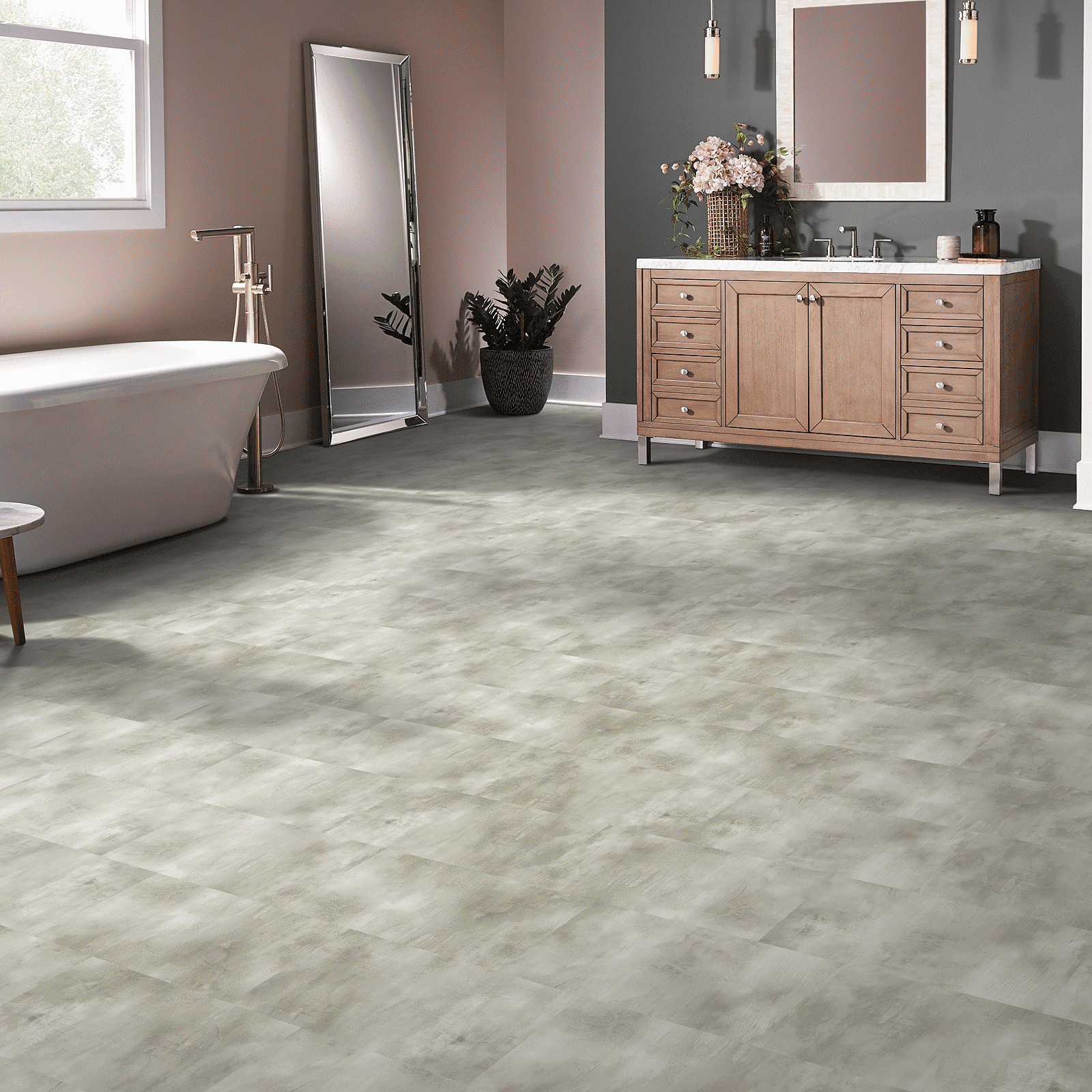 A bathroom with a sink, toilet and mirror.