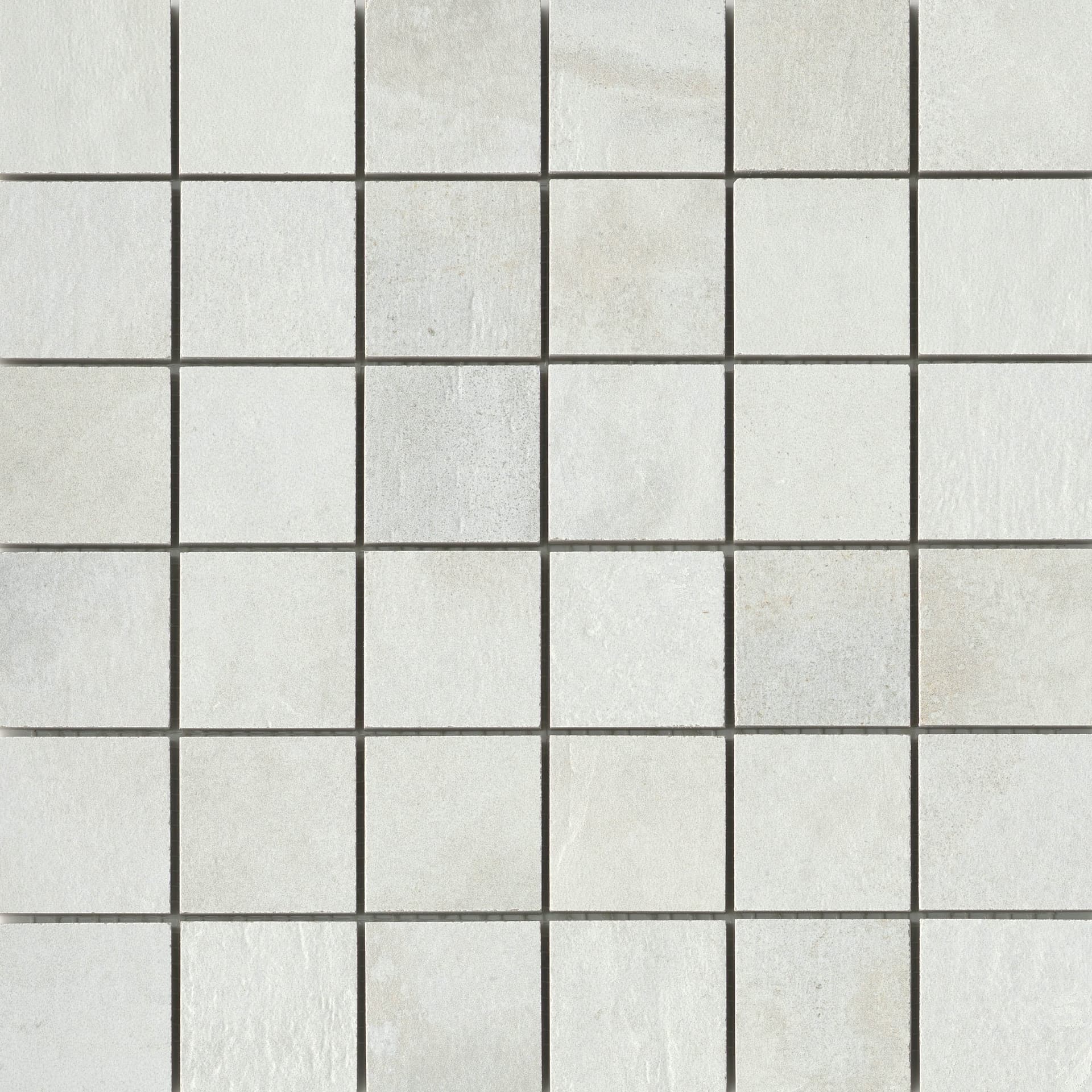 A white tile floor with some small squares