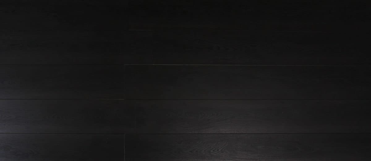 A black background with some type of wood