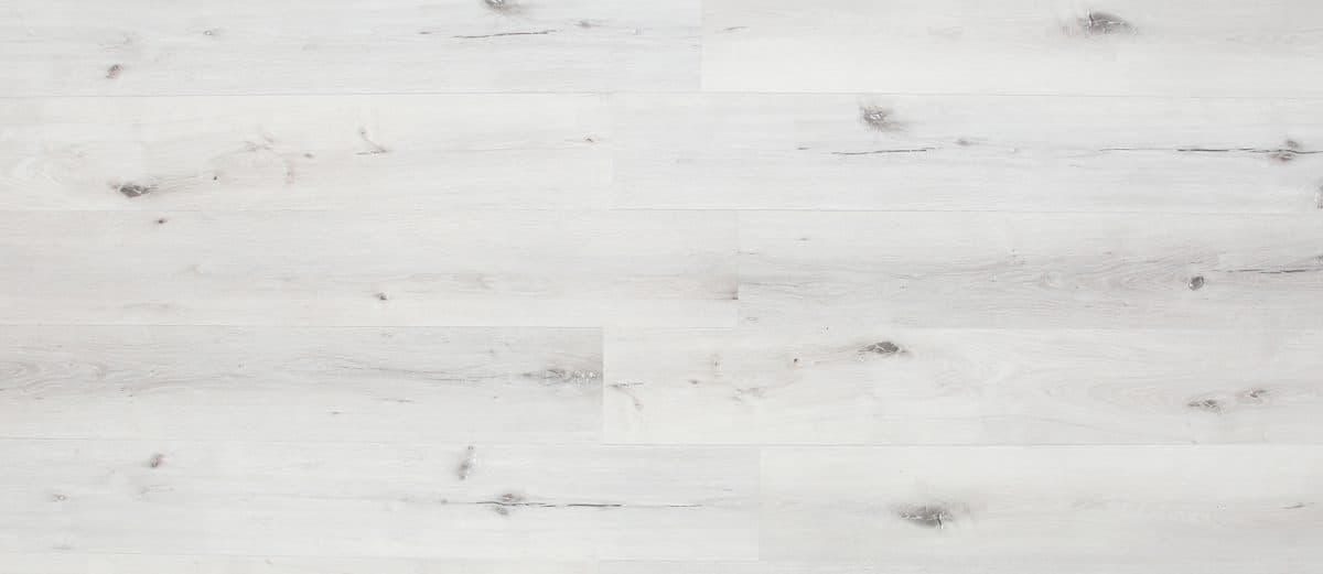 A white wood floor with some gray streaks