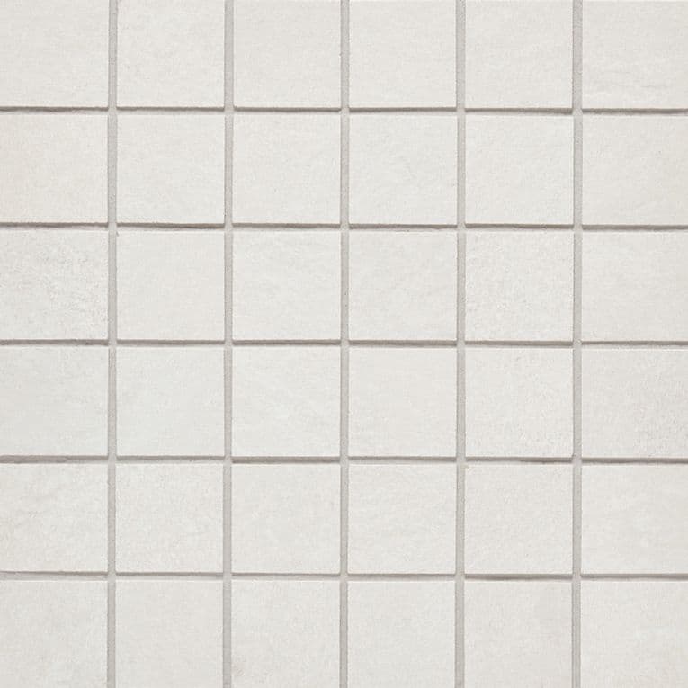 A white tile floor with some small squares