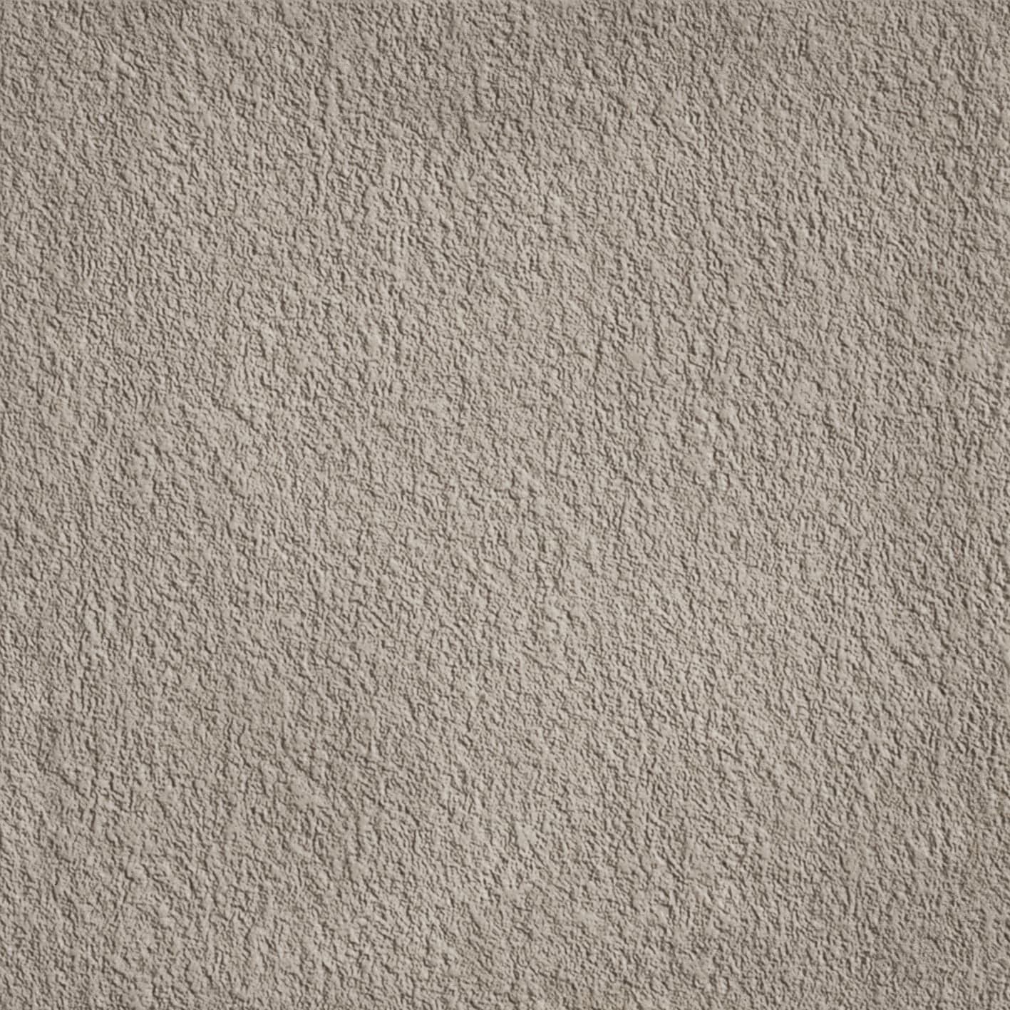 A gray wall with some white spots on it