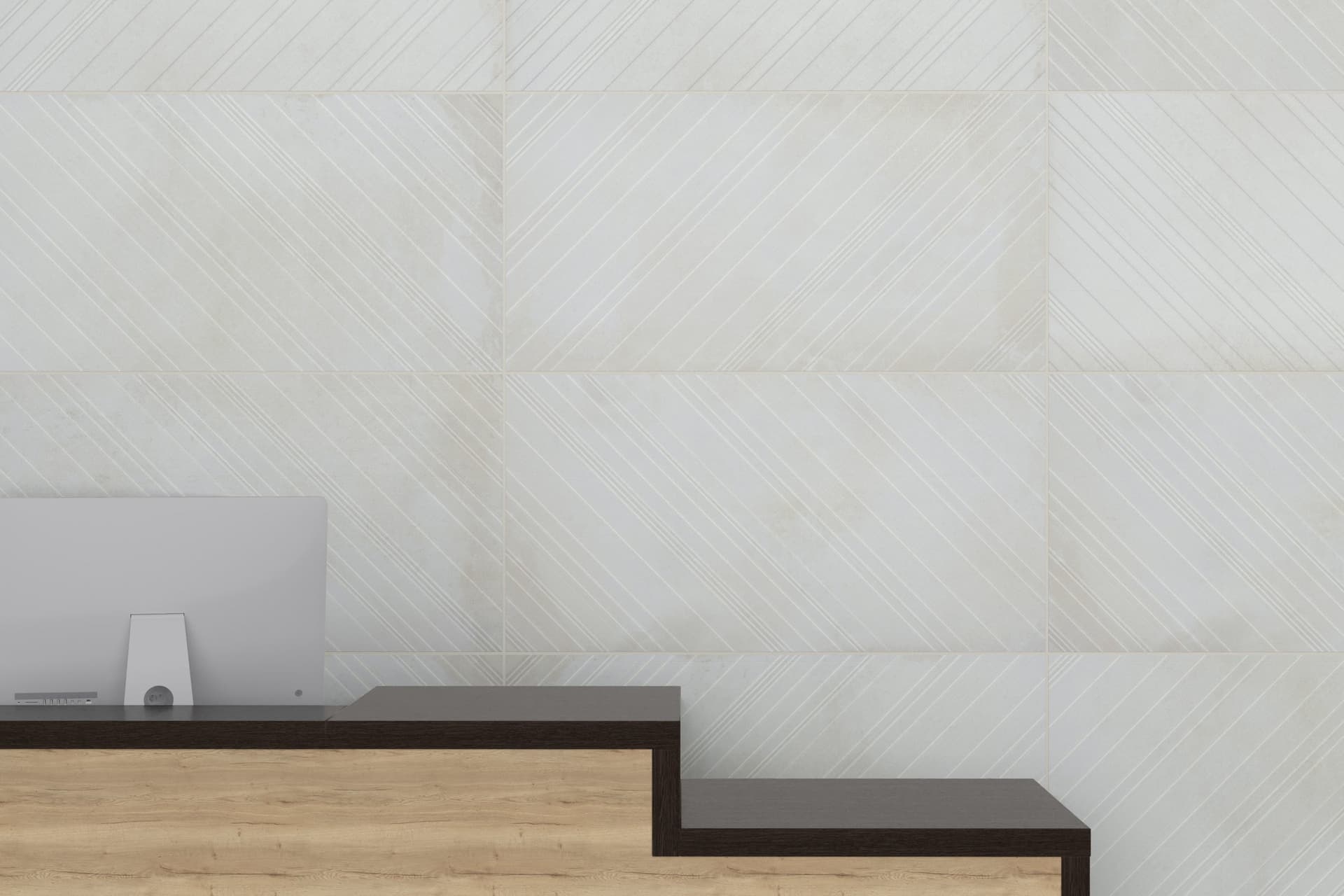 A white wall with two steps leading up to it.