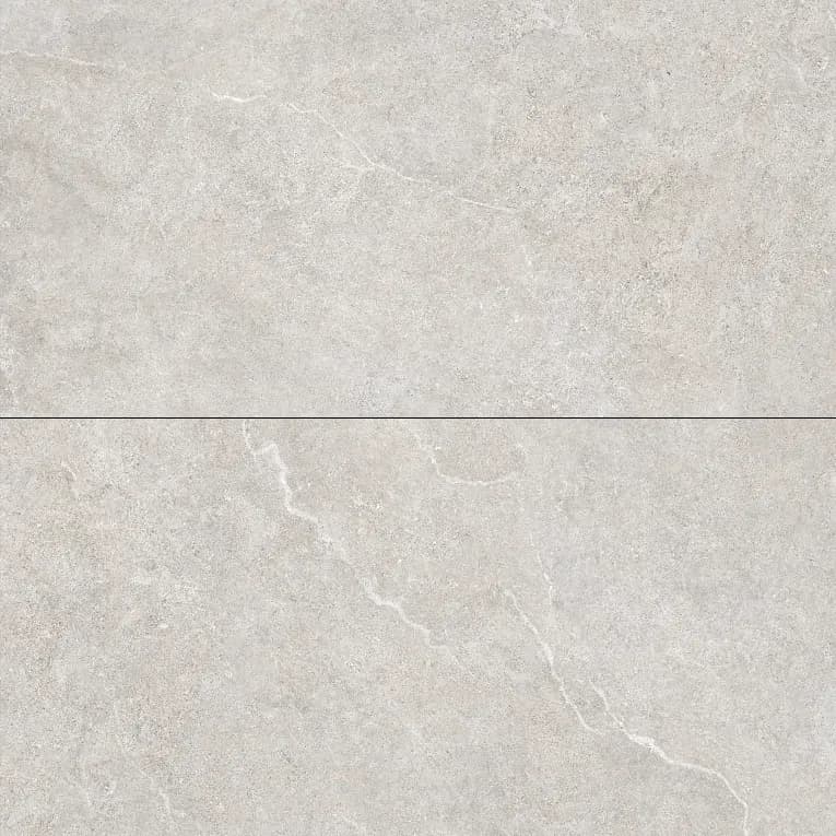 A white marble surface with some small bubbles