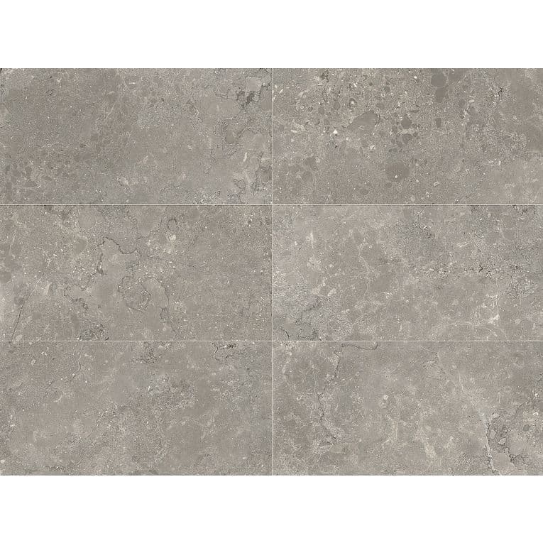 A gray tile floor with some white spots on it