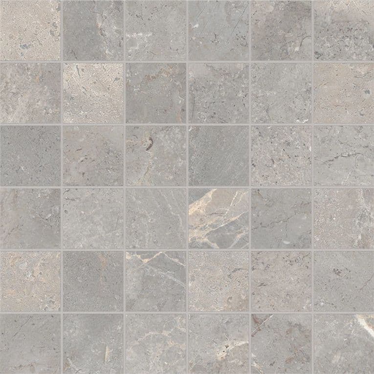A gray tile floor with some small squares