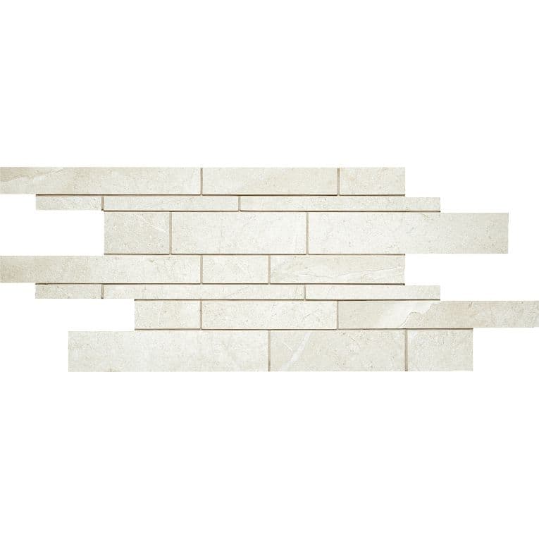 A white brick wall with some small bricks