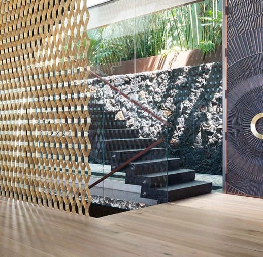 A room with stairs and a wooden wall