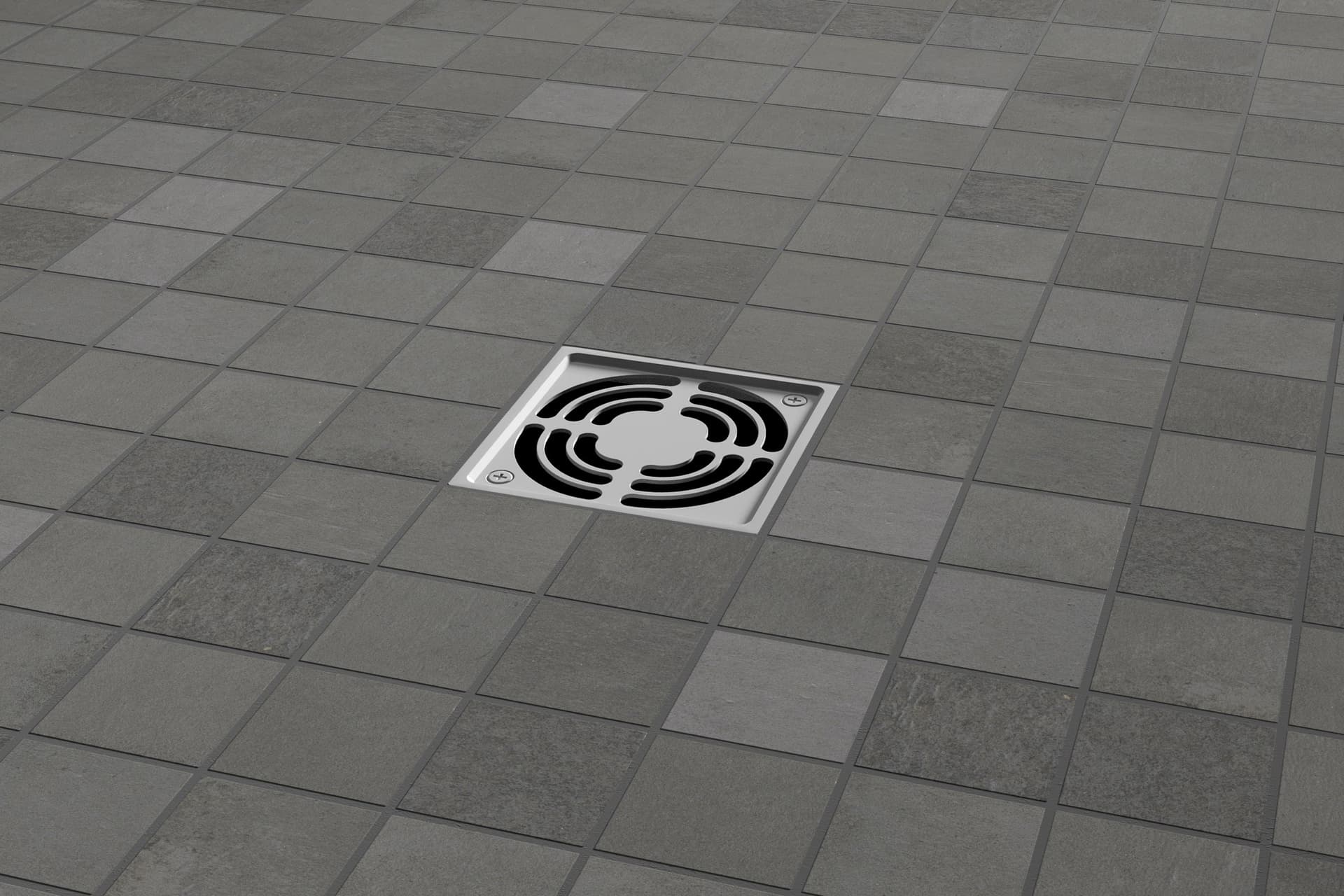 A floor drain with a tile pattern on the ground.