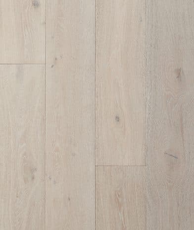 A white wood floor with some type of stain on it