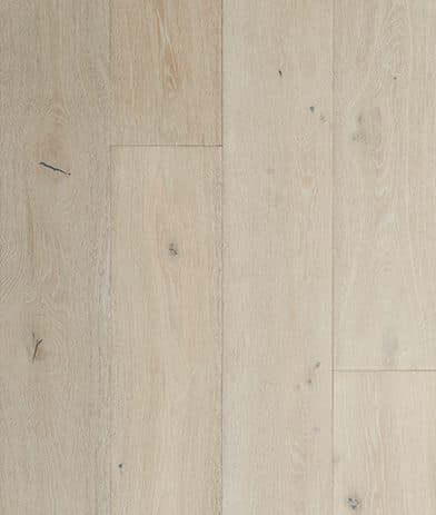 A white wood floor with some brown lines