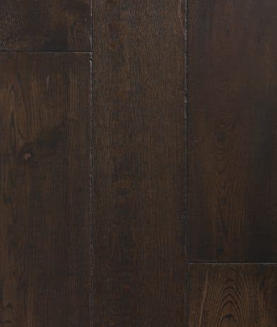 A dark wood floor with some brown lines