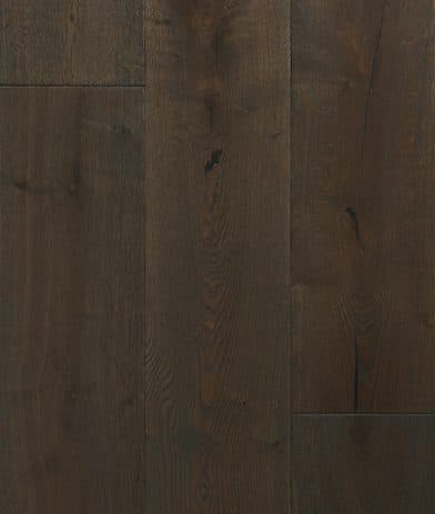 A dark wood floor with some brown lines