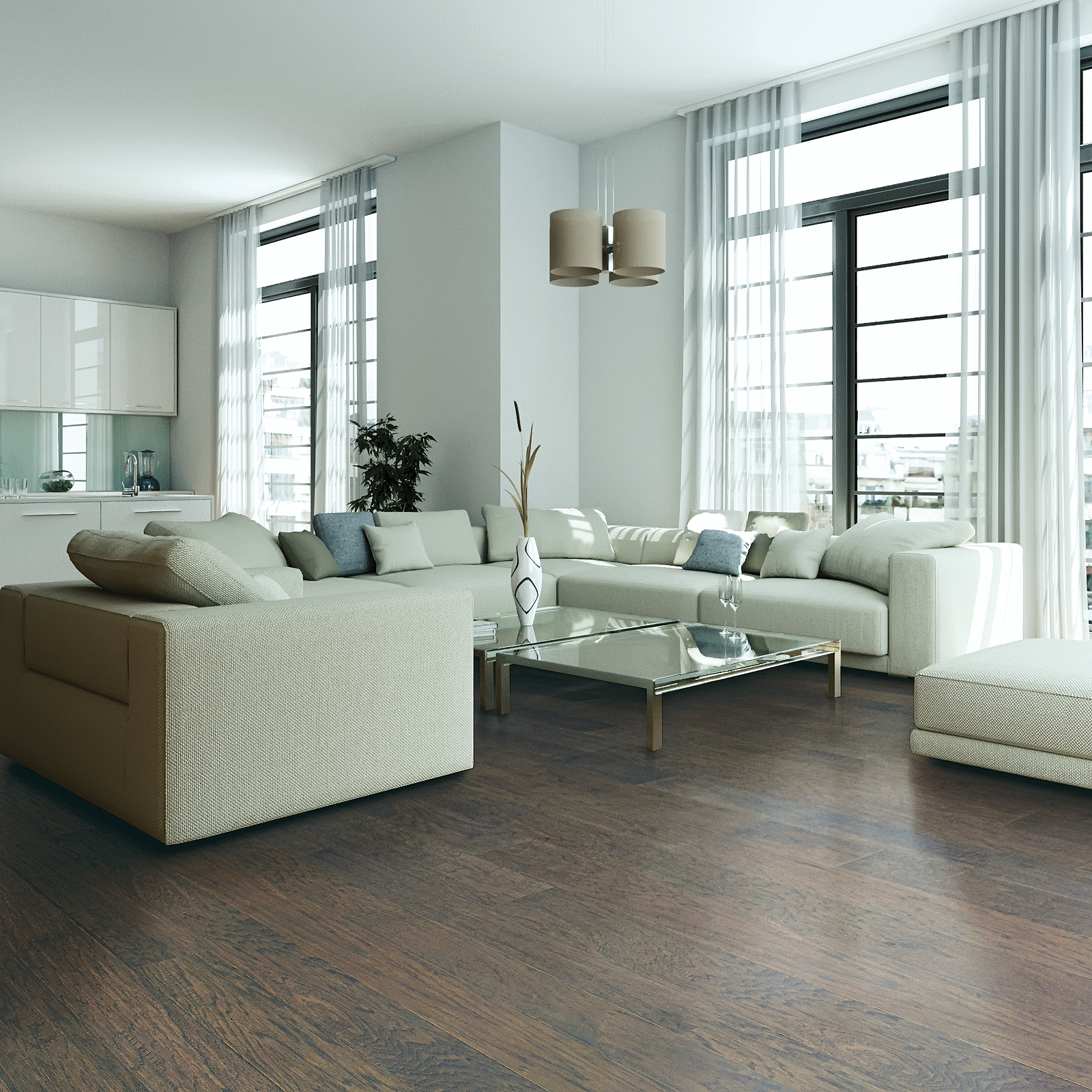 A living room with white furniture and large windows.
