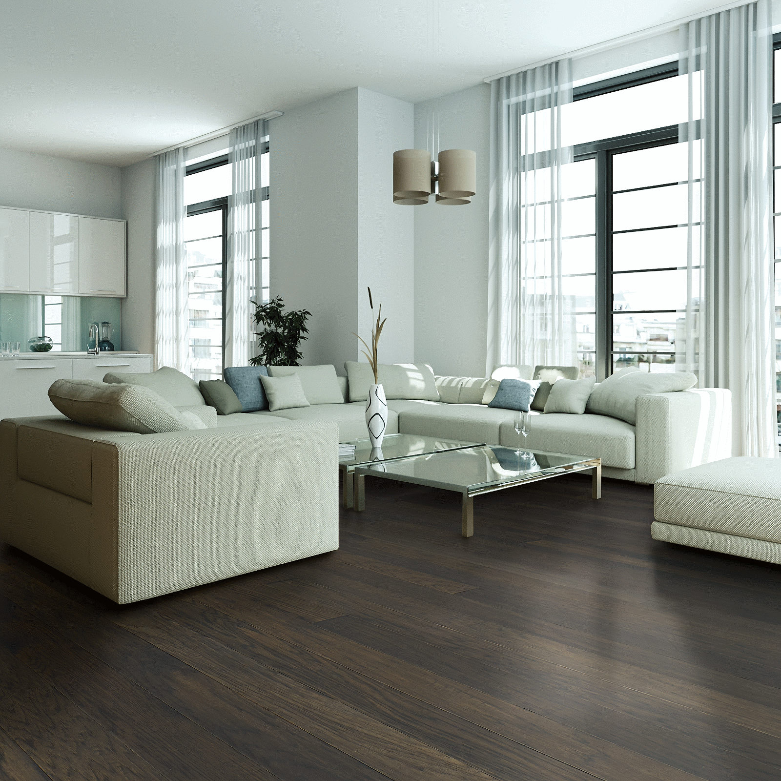 A living room with white furniture and large windows.