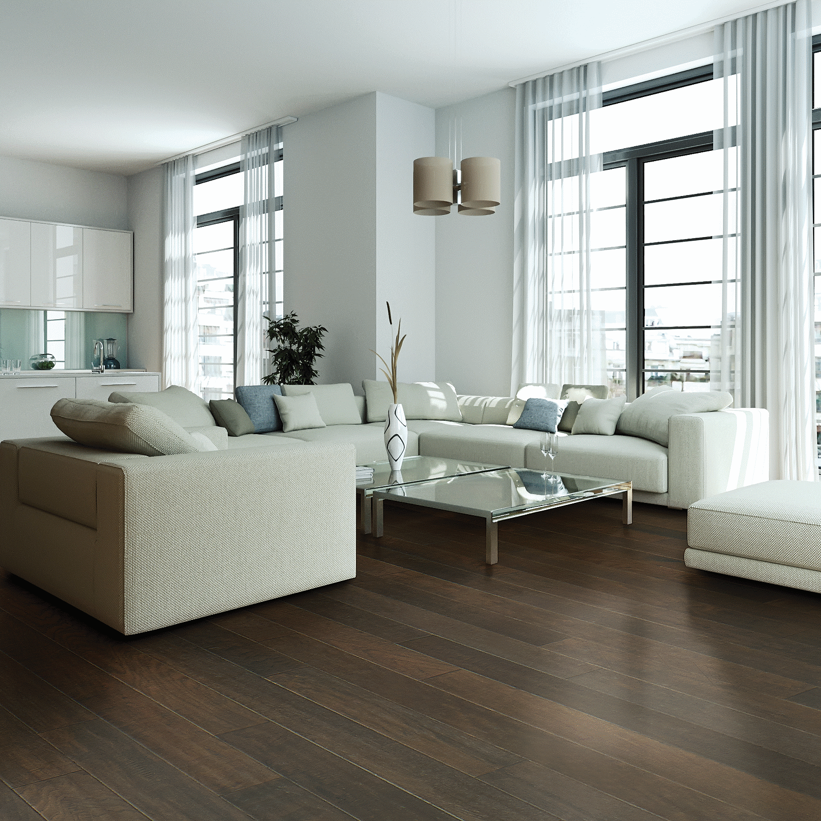 A living room with white furniture and large windows.