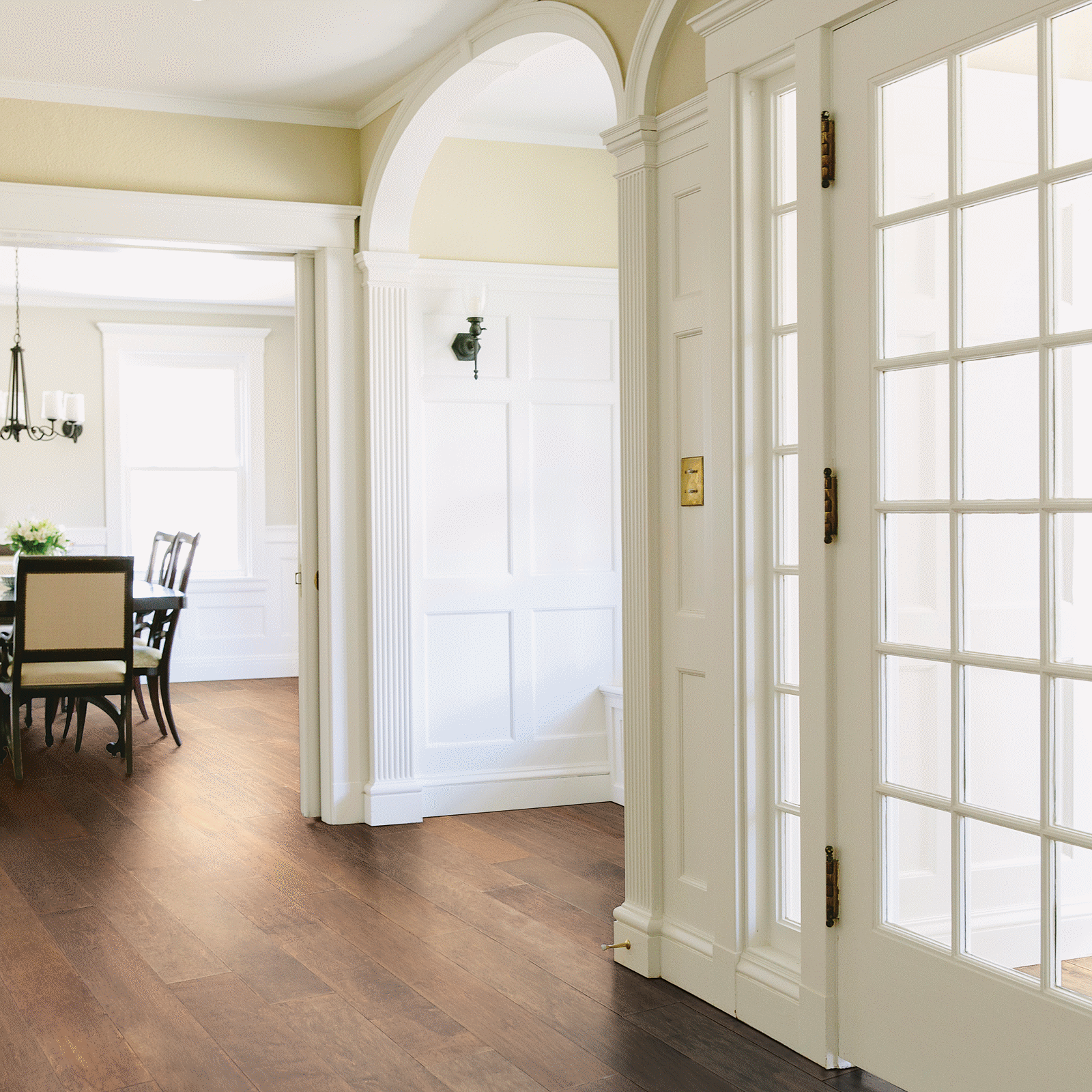 A white door leading to the dining room.