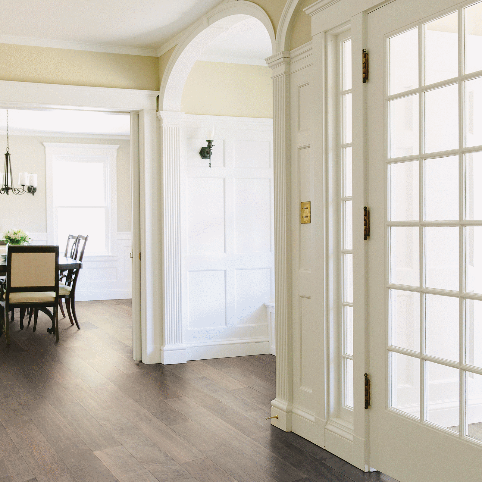 A room with a table and chairs in it