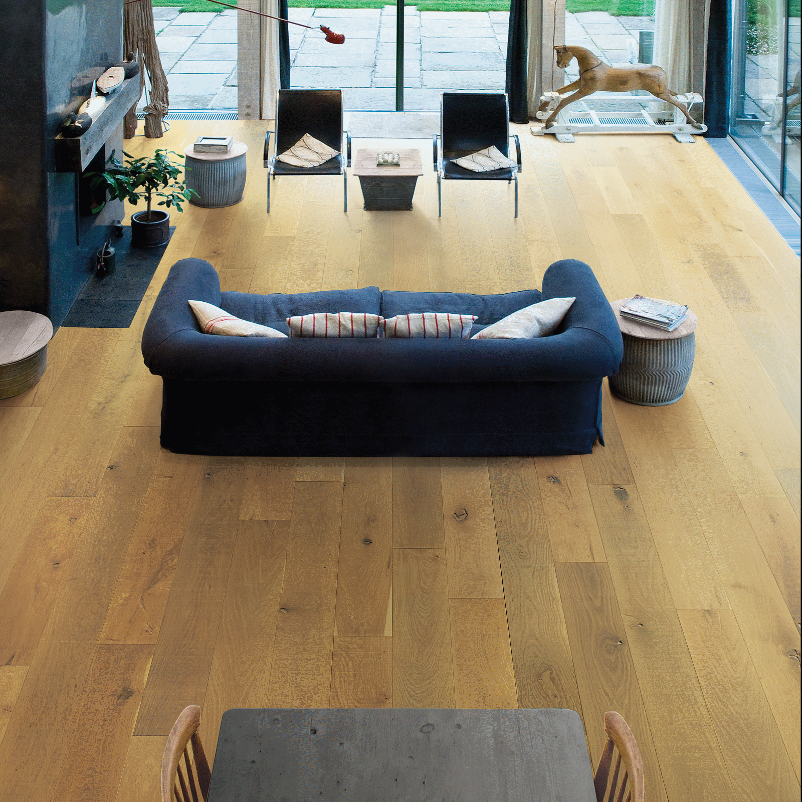 A living room with wooden floors and furniture.