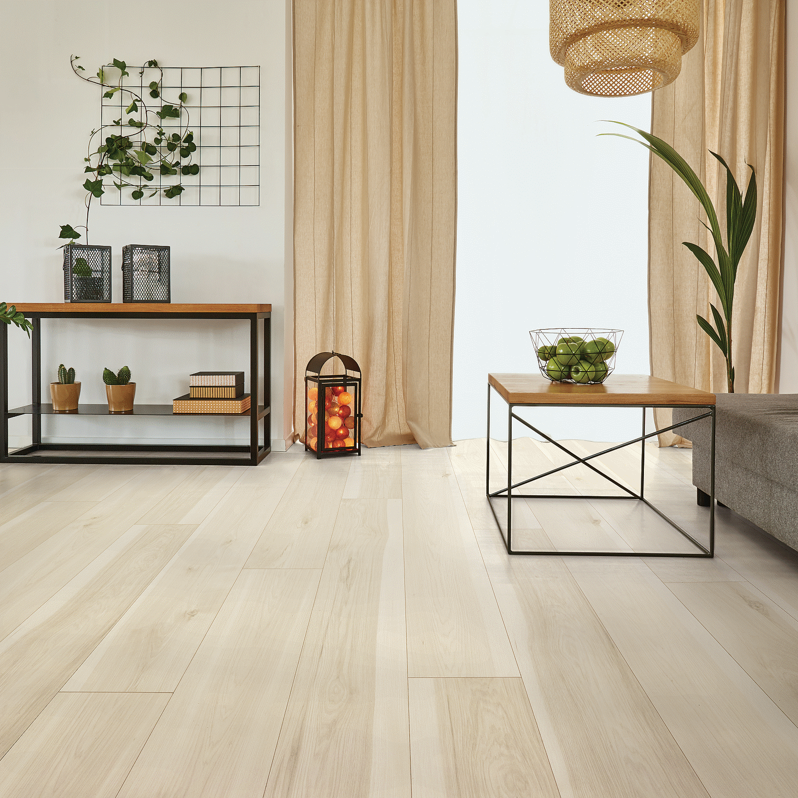A living room with wooden floors and white walls.