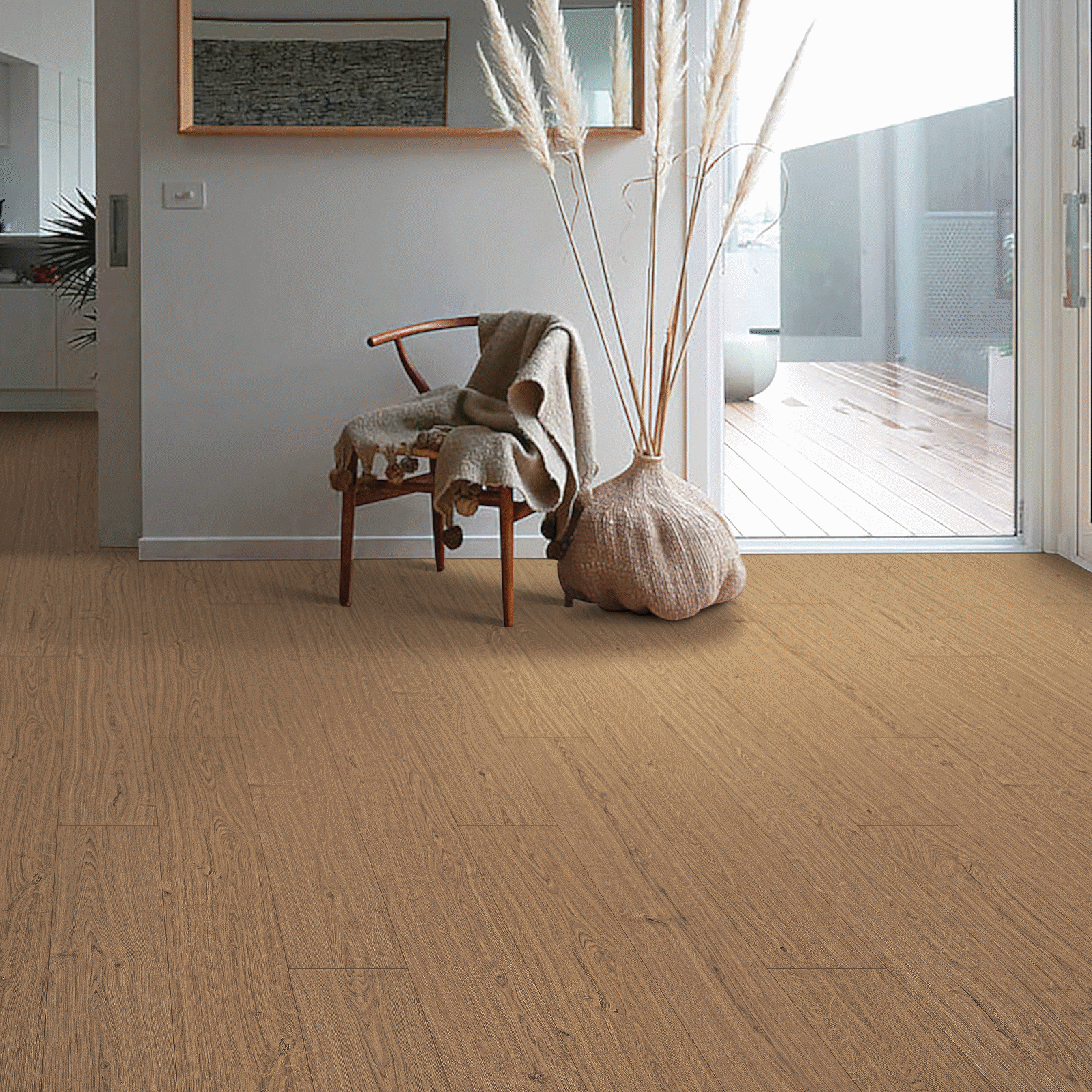 A room with a chair and vase in it.