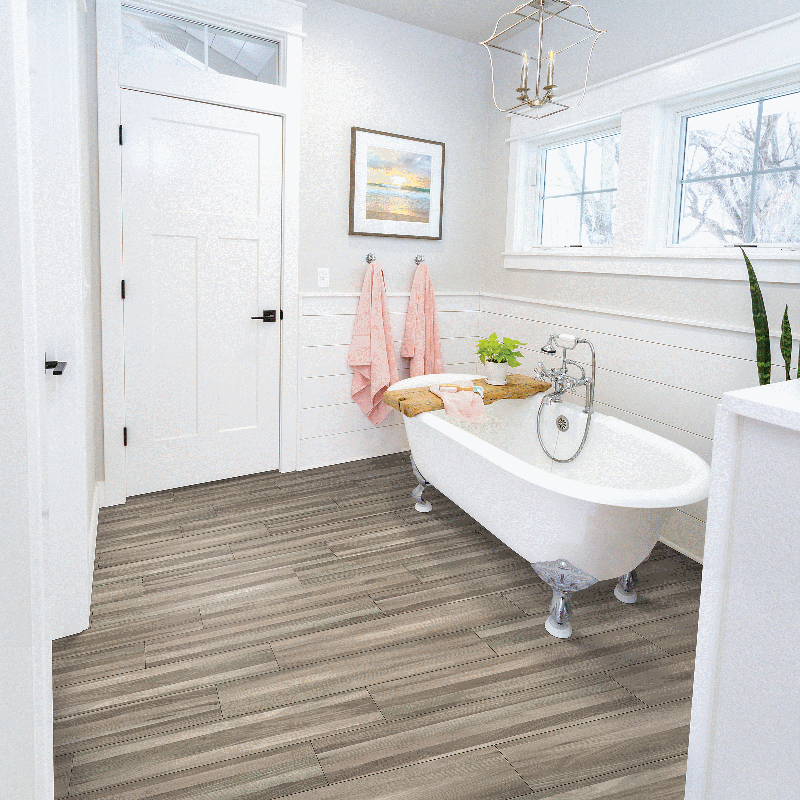 A bathroom with a tub and sink in it