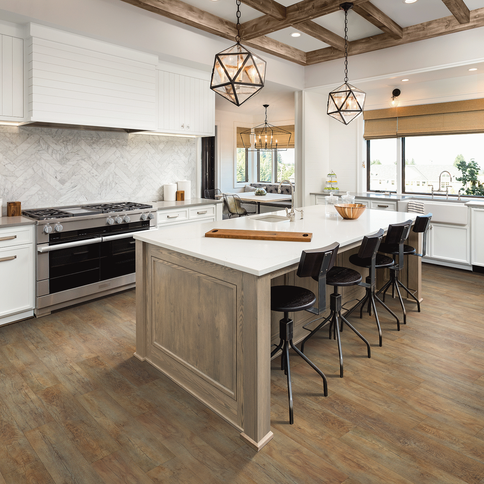 A kitchen with wooden floors and white walls.